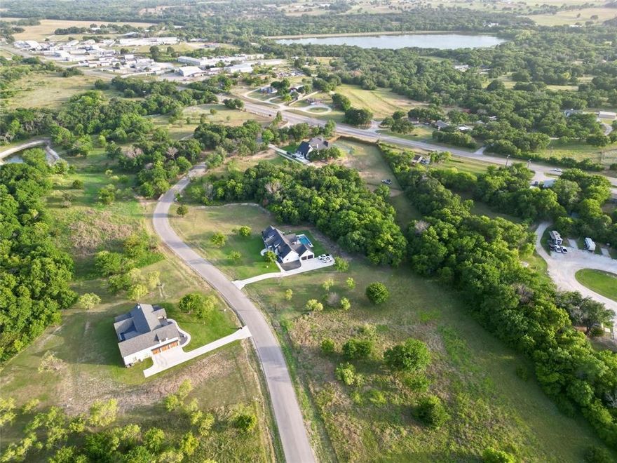 2+ acre lots are now available in the highly sought-after Peaster ISD. Bring your builder and construct your dream home in the private, gated Woodland Lakes community. This area features an abundance of mature trees, wildlife, and several ponds. Conveniently located near Ric Williams, with access from Hwy 920 and Zion Hill, it's just five minutes from Weatherford and 40 minutes from Fort Worth. Septic & well needed, propane is optional
