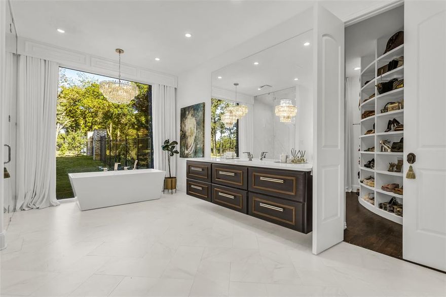 Unmatched beauty in the prestigious guarded and gated golf community of The Estates at Tour 18. This private escape sits on a heavily treed lot and offers a resort style outdoor living area designed for fun and effortless entertaining. The peaceful estate rests on almost two wooded acres and includes a sparkling pool with lazy river, a pool house with shower and half bath, a mosquito misting system, a putting green, fire pit, and a richly appointed outdoor living and kitchen area with bar and sound system. The main house has been exquisitely updated and welcomes you with an impressive entry, vaulted ceilings, designer finishes, and light filled open spaces that will wow your guests. The primary closet is a must see to fully appreciate.  Other features include an oversized driveway for extra parking and basketball, in-ground tornado shelter, full-house generator, roof replaced in 2025, Christmas light ready, and lighting grounding rod.  Many features are smart-home enabled, such as the HVAC system, pool, alarm system, garage doors, entry lock, sprinkler system, and indoor outdoor sound system. Served by award winning Argyle ISD with close proximity to Liberty Christian School and UNT. Ask about special financing when you purchase this property.