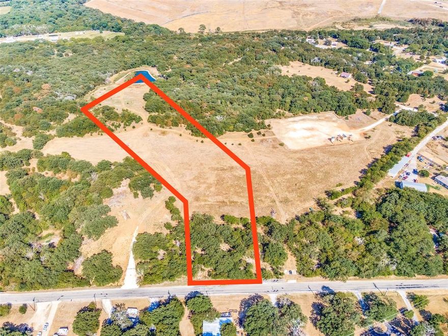 County land with no HOA! Seller is pulling 9.989 acres from a larger parcel to sell. Plat and survey are awaiting final approval. Large oak trees, many deer, a secluded space with shared-ownership of the deep pond for fishing! Horses permitted! Great road frontage and easy access to I-35. (Boundary lines on photo are approximate and subject to approval.) Can possibly be combined with the lot next to it.