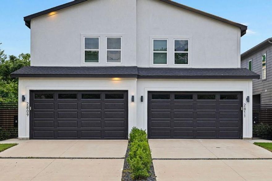 Modern 3-bedroom, 2-bathroom duplex in the heart of Trinity Groves, available for immediate move-in! This home features an open floor plan with decorative lighting throughout and abundant windows that bring in plenty of natural light. The spacious kitchen includes a large island, microwave, oven, and a generous pantry. The living room offers an electric fireplace, creating a warm and inviting atmosphere. A gated front entry leads into a private patio, and a 2-car garage provides secure parking. Located upstairs, the primary suite features a private balcony, a large walk-in closet with built-ins shelves, double vanities, and an oversized stand-up shower. The two secondary bedrooms share a convenient Jack-and-Jill bathroom, and the laundry hookups are also located upstairs for added convenience. Enjoy a large backyard with a covered patio, perfect for relaxing or entertaining. Located minutes from Downtown Dallas, Greenville Ave, and Knox Henderson, this property combines comfort, style, and prime location. Ready for immediate occupancy. Schedule your tour today!