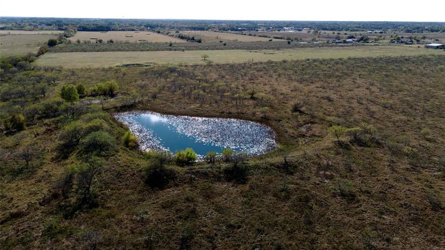 Beautiful 11 acre tract located in Crandall ISD along County Road 4102!  Easy access to Highway 175,
this property offers a short commute to Dallas while maintaining a peaceful rural setting. The land features fertile black
clay soil, two ponds, and a blend of native grasses and scattered mesquite, creating a balanced mix of open pasture
and natural cover.  Great for a small working farm and homestead for you and your family! NO Restrictions, come build your Barndo, shop, or dream house and do it at your own pace. Come check it out and bring your ideas and vision!