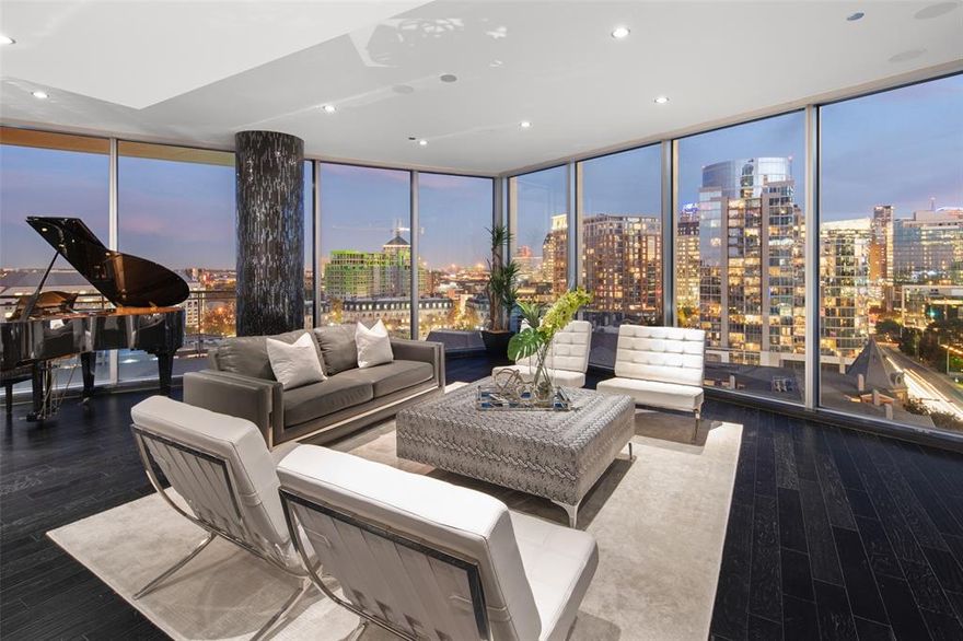 Fabulous 3bed 3.5bath custom condo in the luxurious Azure building. Enjoy unparalleled views of downtown Dallas with floor to ceiling windows and 2 balconies complete with fireplaces. Chef’s kitchen is designed to for entertaining with unique wrap around granite counters and built-in dining. Miele appliances, subzero, and wine cooler. Custom cabinetry in the kitchen and baths with stainless steel veneers give this unit a very clean and sophisticated look. Closet systems in all 3 bedrooms and laundry. Audio system throughout, electric shades in primary bedroom. Dramatic tiled column and entry way art are special touches. 4 car garage with epoxied and sealed flooring and 3 storage units.