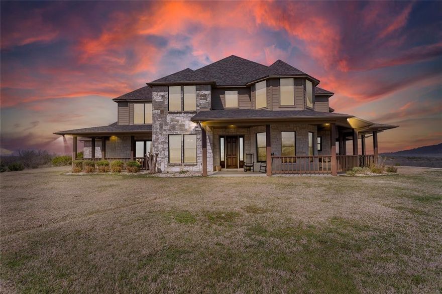 Perched atop more than 30 breathtaking acres with panoramic 360° views and overlooking beautiful, this extraordinary estate offers the perfect blend of luxury, privacy, and iconic Texas scenery.

Designed for both grand entertaining and everyday comfort, this stunning 5-bedroom residence features refined living spaces throughout. A formal library provides a quiet retreat for work or reading, while the elegant dining room flows seamlessly into the spacious eat-in kitchen, complete with a butler’s pantry for effortless hosting. A basement adds versatility for storage, hobbies, or additional living space.

Upstairs, a generous second living area includes a dedicated study space, creating the ideal layout for family living. Secondary bedrooms offer private baths and walk-in closets, ensuring comfort and convenience for family and guests alike.

The primary suite is a true sanctuary, featuring a private sitting area and exclusive porch access, perfect for morning coffee while taking in the peaceful views.

Step outside to your own resort-style retreat. A sparkling diving pool invites you to cool off under wide Texas skies, while expansive wraparound porches create the perfect setting to relax and unwind. From sunrise to the most amazing Texas sunsets, every angle of this property captures the beauty of its surroundings.

This is more than a home, t’s a lifestyle defined by space, serenity, and unforgettable views.