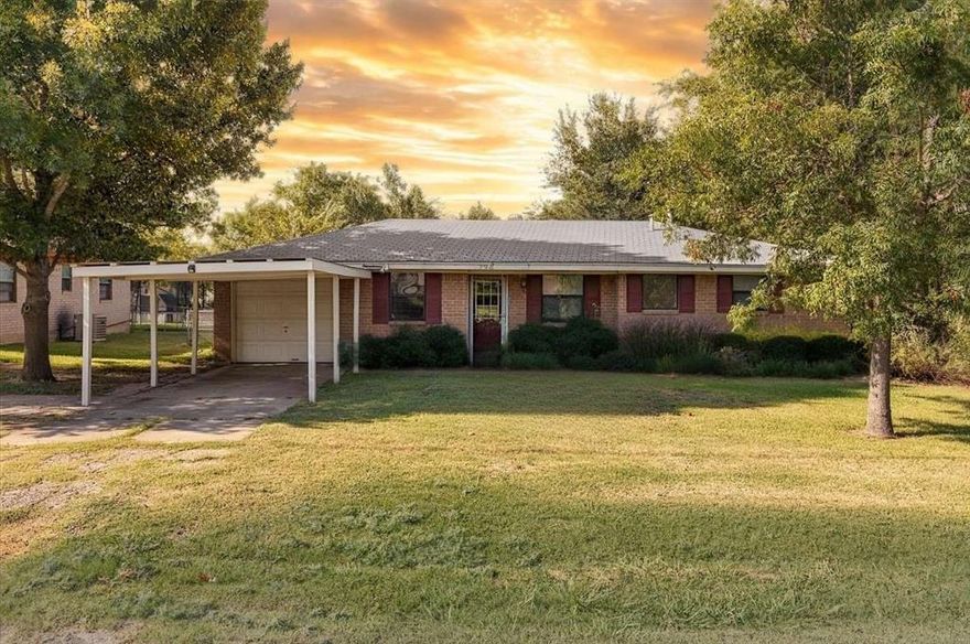 Welcome to this cozy home nestled on a generous size lot with beautiful mature trees in the heart of a charming and growing community. Located just minutes from the historic Old City Park making it perfect for weekend strolls and community events surrounded by the warmth of small town living.This home offers both comfort and convenience. Inside you will love the thoughtful layout , living room features a fireplace that creates the perfect spot for relaxing or gathering with friends. Kitchen is bright and cute with just the right amount of storage and workspace while the dining area is  positioned for everyday meals or entertaining. Both bedrooms are comfortable and inviting and the bathroom is designed with practicality in mind.  Imagine sipping your morning coffee on the back deck as the sun filters through the trees or hosting weekend barbecues. 2 storage buildings offering plenty of space for hobbies, tools or just extra storage space. 
Property comes with both an attached single-car garage and an additional attached carport, providing excellent parking and storage solutions.
The generous lot size is truly the star of this property, offering endless possibilities for expansion, landscaping, or outdoor recreation. Whether you're a first-time homebuyer looking for an affordable entry point, an investor seeking potential, or someone who enjoys putting their own stamp on a property, this home in thriving Pilot Point deserves serious consideration.