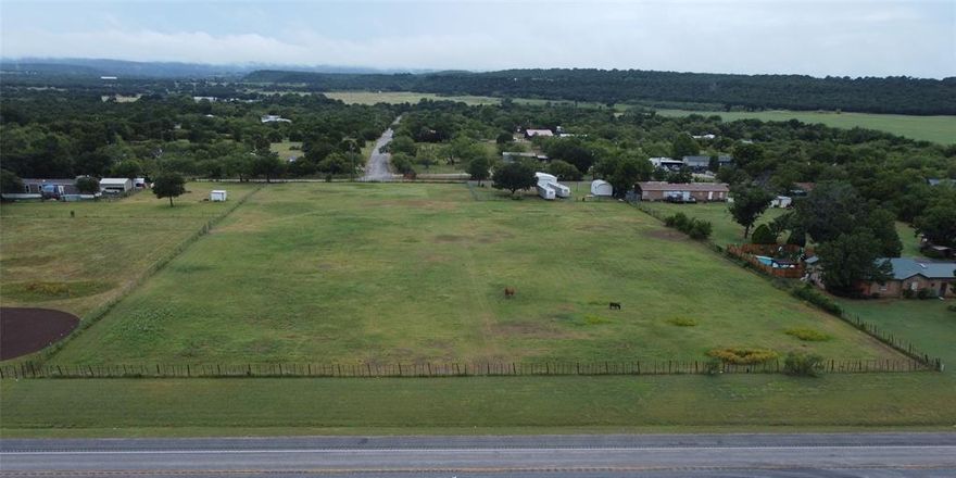 MOTIVATED SELLER! BRING YOUR OFFERS! Bring your horses, horse trailers, goats, cats, dogs, and love of nature and adventures! Big workshop, large Morgan storage building with half bath. Build your dream home, or park the RV with septic hookup and 200 amp electrical service already on property. Fenced all the way around. You could put an entrance off of 337 if you chose since you have 300+ feet of highway frontage. This property is less than 30 minutes to PK Lake, Mineral Wells State Park, and the new Palo Pinto State Park opening soon. You’re near public water access for fishing and recreation.