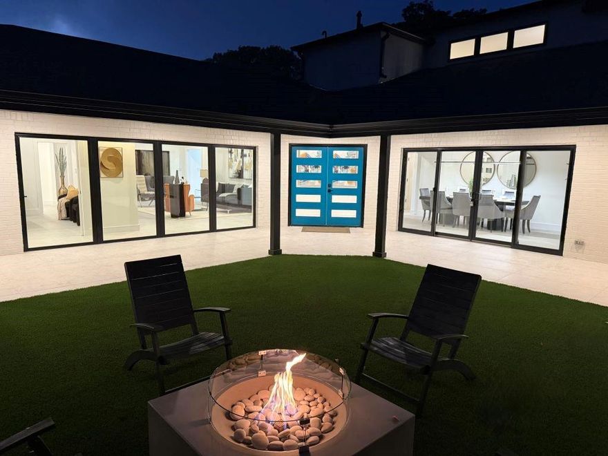 Welcome to Casa Murada—The Walled House—a Canyon Creek mid-century modern rebuild with luxury finishes and smart-home features. Taken to the studs in 2025, it balances authenticity, innovation, & sophistication featuring 2 family rooms, hearth room, dining room, study, 4 en-suite bedrooms, & pool bath. Walls of glass blur house & garden, framing a 2,000 sq ft courtyard with smart-home firepit in front & a resort-style renovated pool with smart-home lighting & heating in back. Casa Murada’s indoor-outdoor lifestyle is accentuated by 2’×4’ tile covering the heart of the home, the courtyard porch, & the pool-side patio. • The chef’s kitchen has Basalt slab counters & backsplash, custom slim-shaker cabinetry, 8’ island with 8’ skylight, & professional appliances including 68-in. refrigerator-freezer, 48-in. range, & double-drawer dishwashers. Adjacent to the kitchen is a hearth room with gas fireplace. The butler’s pantry—linking kitchen & dining—includes Vintec dual-zone wine cabinet, dishwasher drawer, & bar sink. A walk-in pantry & oversized laundry provide custom storage. • The lower-level primary suite has courtyard access, spa bath with 14’ vanity, & 10’×16.5’ closet adjoining the laundry. On the opposite end, a large study & a guest suite open to the courtyard & the pool. Upstairs is the second family room with wet bar & Vintec wine cabinet & 2 en-suite bedrooms. All bedrooms & the upper family room are finished in 7.5-in. oak floors. • Casa Murada has a 3-car garage & 2 driveways. All-new mechanicals include 2 high-efficiency smart-home HVAC systems, plumbing, electrical, gas, foam insulation with primary suite soundproofing, smart-home LED lighting, & access technology. • Casa Murada honors mid-century heritage while embracing today’s design & function. In the heart of Canyon Creek, steps from the country club & DFW Airport train, Casa Murada is a simple, modern masterpiece capturing the spirit of its era and redefining what it means to be home in Canyon Creek.