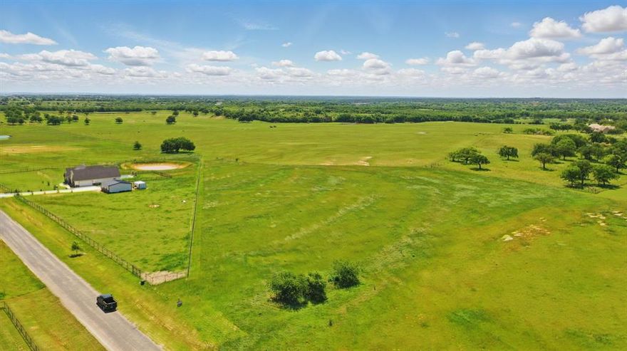 Bring your builder! Bring your imagination and make this beautiful 5.152 acre piece of property your dream home. This is one of the few remaining lots in High Meadows Ranch conveniently located just outside of downtown Poolville. Located just 12 miles northwest of Weatherford and just 50 minutes to Downtown Fort Worth, this gorgeous piece of land is ready for your custom build. The lot is mostly level and has a slightly elevated position that gives you fantastic sunset or sunrise views. Barndos allowed, this development doesn't have a lot of tough restrictions but comes with the ones you want in place for a development this size. Horses allowed and shops and outbuildings are permitted, too. There are paved access streets and quiet, country living just waiting for you to join in. Call today for more information or set up a time to view this beautiful 5 acre property.