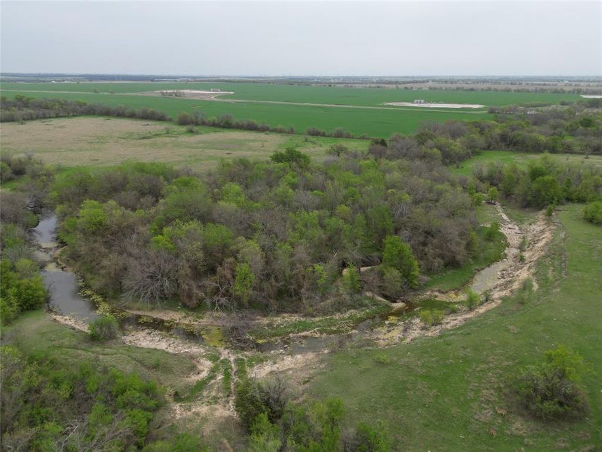 Beautiful topography and amazing location highlight this 121 acre Ranch just outside of Denton and Krum.  Rolling pasture land with deep creek and water features give this land great character and offers multiple build sites with gorgeous views.  The Northeast portion of this tract has amazing established trees and creek throughout approximately 37 acres of flood plain.  Current Ag Exemption in place with cattle on property.  Bolivar Co-Op water as well as Co-Op Electric at the road.