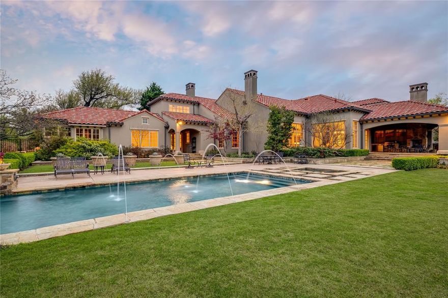 An incredible opportunity for an estate property in Preston Hollow. This remarkable residence graces a sprawling 1.1 acre expanse of lushly landscaped grounds nestled on Ursula Lane within the esteemed Lobello Estates. Conceptualized by the visionary Christy Blumenfeld, this French inspired Mediterranean seamlessly exudes a rich warmth of beautiful elements, design & comfortable spaces. Natural light overflows throughout the first floor showcasing vaulted wood beam ceilings, a library, temperature controlled wine cellar, wet bar, chef's kitchen & family room. Tucked away into its own wing, the primary room features dual bathrooms & closets, fireplace, sitting room and private entry to the pool & spa. All other 4 bedrooms ensuite with a media and game room upstairs, porte cochere & a 3 car garage.