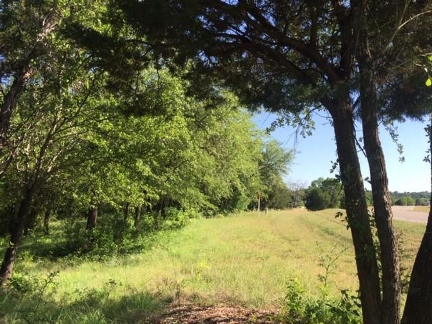 Trees, Trees and more Trees. Beautiful lot backing to a nature trail. Just waiting for you to build your dream home. Gated community with championship golf course, clubhouse, 2 pools, tennis, basketball, hiking trails, playground, community ponds, fitness center & 24 hour security.