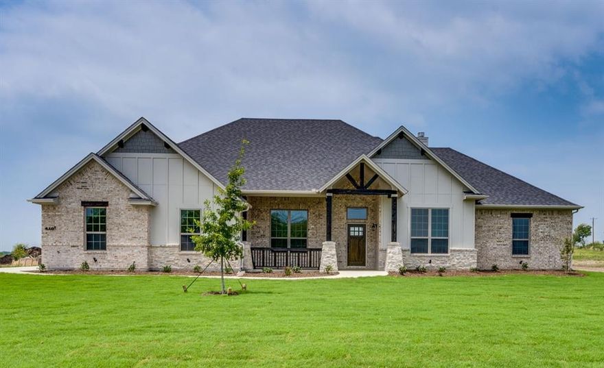 ***HOT DEAL ALERT!*** FANTASTIC OPPORTUNITY FOR INSTANT EQUITY AS HOME IS PRICED WELL BELOW COMPS! Crafted by Tree Hill Homes, the original TexCraft builder, this bright and airy home features 4 oversized bedrooms, a dedicated office, and an open-concept floorplan perfect for entertaining. With 10-foot ceilings and abundant windows throughout, natural light fills every corner. The living room centers around a gorgeous floor-to-ceiling stone wood-burning fireplace with a custom cedar mantle. The gourmet kitchen boasts upgraded quartz countertops, custom hand-stained soft-close knotty alder cabinets, and an enormous walk-in pantry. Enjoy maximum privacy with a split bedroom layout. The spacious primary suite is a true retreat with a freestanding tub, large separate shower, quartz countertops, and a generous closet that conveniently connects to the laundry room. Additional highlights include a mud bench and extra closet off the oversized 3-car garage (24x30) with 8-foot doors (Yes - your truck can fit!), a half bath with backyard access ideal for future pool days, and covered front and back porches to take in the peaceful surroundings. Located outside city limits with NO city taxes and a low 1.5% tax rate, this home perfectly blends country tranquility with city convenience—just 5 minutes from I-35E for easy commuting, shopping, and dining. HUGE SAVINGS! Save on price, taxes and home insurance with a discount for new roof! HOME IS ALMOST COMPLETE AND READY FOR SHOWINGS. PICS ARE FROM BUILDERS OTHER HOMES TO SHOW STYLE ONLY. HOME WILL BE COMPLETE END OF MAY, EARLY JUNE. BUILDER HAS SEVERAL HOMES IN NEIGHBORHOOD BEING BUILT. ASK AGENT ABOUT OTHER FLOORPLANS IF THIS ONE DOESNT WORK FOR YOU. **SCARBOROUGH FAIRE HAPPENING ON WEEKENDS THIS MONTH SO EXPECT TRAFFIC IF GOING ON SATURDAY OR SUNDAY*