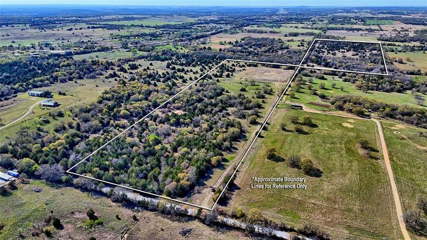 44.91 ACRES - This is the perfect hunting getaway being covered in heavy timber that provide cover for wildlife and a few open meadows with 2 small stock ponds. The ranch is rolling with several building sites and has paved road frontage.