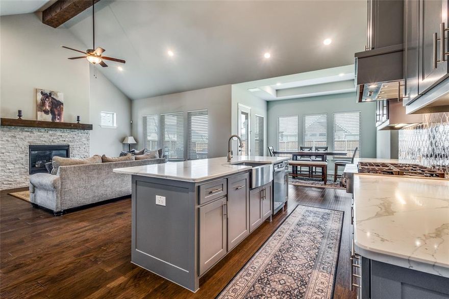 Motivated Seller! You're going to love this beautiful custom Drees Home on a corner-lot in a unique piece of Canyon Falls Village with NO PID or NO MUD fees. Zoned to top-rated Argyle ISD with Argyle South Elementary and Argyle HS located inside the neighborhood, as well as Liberty Christian private school within 5 miles. This 4-bed, 4-bath home offers an exceptional floorplan with soaring ceilings, updated wood-beam, designer lighting, and hardwood-style floors -- filled with natural light. The spacious living room with a stone fireplace and custom mantle flows into a chef’s kitchen featuring a large island, stainless appliances, double oven, abundant cabinetry, and walk-in pantry. The primary suite offers a newly remodeled spa-style shower and dual vanities leading into a large master closet with the large laundry space conveniently located to bedrooms. Upstairs, enjoy a generous game room and private guest suite with plenty of flex space for entertainment, workout room, or more. Additional highlights include epoxy-coated 2-car garage plus additional separate 1-car garage, plus a covered patio overlooking a meticulously landscaped large yard. Enjoy HOA community events and social clubs, included internet and tv, front yard maintenance, along with amenities including resort-style pool, fitness center, clubhouse, nature and paved walking trails, dog park, catch-and-release fishing pond, water features, and extensive preserved open space (200 acres) weaving through the community—all with quick access to FM 1171, US 377 & major highways for easy commutes to DFW airports, schools, dining & entertainment.