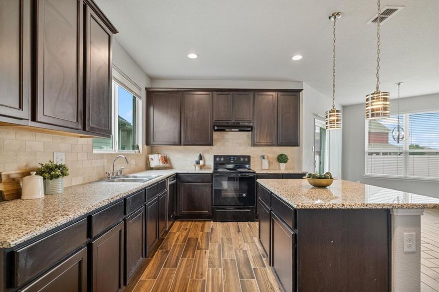 Step inside this beautifully appointed two-story home in the highly sought-after community of Providence Village. An expansive open-concept first floor sets the stage for effortless entertaining and everyday living. Sweeping wood-look tile flooring flows throughout the main living areas, seamlessly connecting the spacious living room, dining space, and well-designed kitchen. The kitchen is thoughtfully equipped with granite countertops, a large center island, and a walk-in pantry conveniently located within the utility room, offering both style and functionality. A desirable second primary suite on the first floor provides exceptional flexibility, ideal for multi-generational living or extended guests. Upstairs, a versatile second living area offers endless possibilities as a home office, game room, or play space. The private main primary suite serves as a true retreat, featuring a comfortable sitting area, a spacious ensuite bath, and dual walk-in closets. Two additional bedrooms are well-sized and share a nicely appointed full bathroom. Outdoors, a large backyard provides ample space for gatherings, play, and relaxation. Located in a fast-growing area with exciting nearby retail development including a new Kroger and Target coming soon, this home offers both comfort and convenience in an exceptional setting.