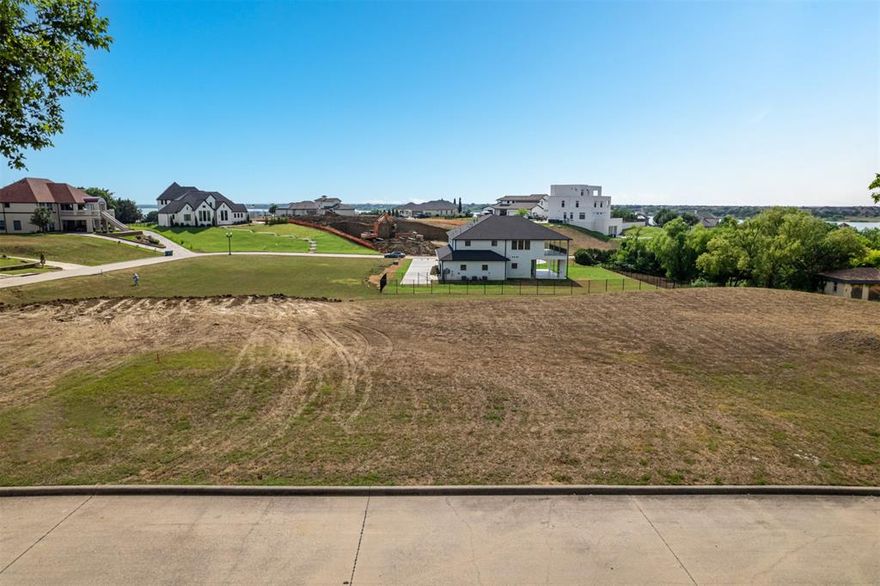 Bring your own builder and design your custom dream home on a nearly half acre property in the gated luxury neighborhood of Water's Edge. Enjoy pristine views of Lake Lewisville just feet up the hill from the lake. This neighborhood has a great location with close proximity to the Star, The Shoppes at Legacy, and Grandscape. Only 20 minutes from the DFW airport. This location and neighborhood has it all. Homes in the neighborhood range from approximately 3,000sq ft up to 8,000+ sq ft.