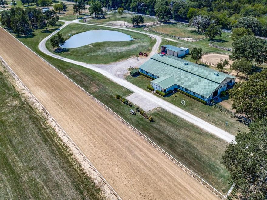 Great development opportunity for outstanding horse training facility in Quinlan. Fronted by a new busy bypass as well as a paved county road, would be a great all around investment for a developer or a professional horse trainer. Acreage is beautiful with scattered trees and improved pastures and 3 ponds. Property is fenced into 16 paddocks with lanes dividing them most with sheds. There are 3 main barns with a total of 72 stalls. All barns feature tack rooms, feed rooms and wash racks. The newest barn has an office with bar area and vet area with stocks. Another has 2 dorm type rooms a kitchen and bathroom. All horse barns fly spray systems. There are 4 round pens 1 covered round pen, Hay barn, equipment barn and storage shed.
Included are 2 doublewide and 1 singlewide mobile homes for trainers and help. Water is supplied by a well and city water. Please contact agent for full list of amenities and any exclusions.