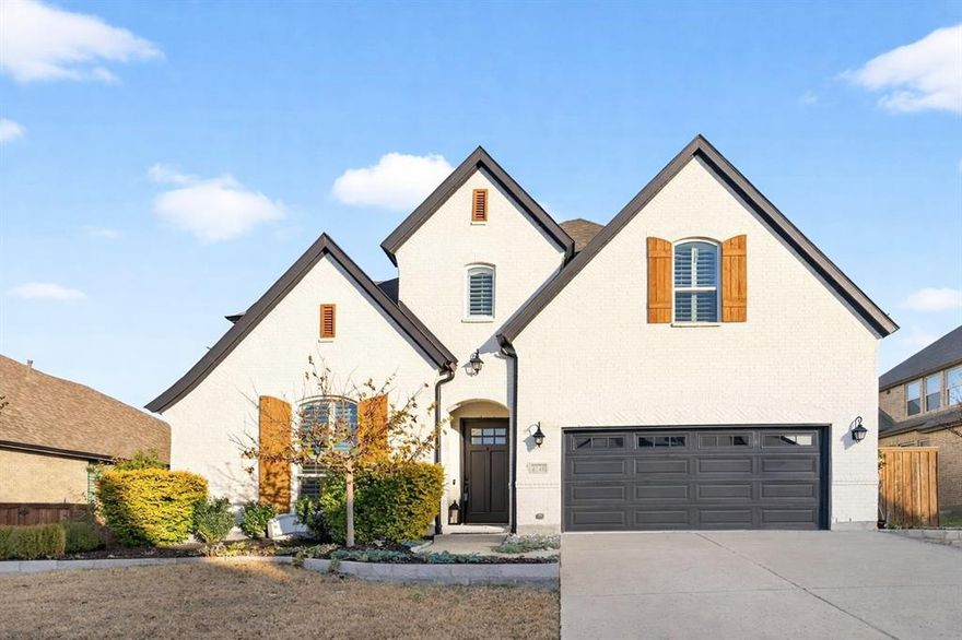 Luxury lease opportunity in Windsong Ranch, tucked away on a quiet cul-de-sac with access to world-class amenities including 5-acre lagoon, pools. fitness center, tennis courts, playgrounds, café and much more. This stunning home offers an open floor plan anchored by a dramatic two-story living room with gas log fireplace and an elegant curved staircase. The designer kitchen features a waterfall quartz island, single-bowl sink, KitchenAid appliances with double ovens, six-burner cooktop, and pot filler—perfect for entertaining. The primary suite showcases bay windows, a custom accent wall, and a spa-inspired bath with separate quartz vanities, freestanding tub, oversized frameless shower, and a walk-in closet with utility room access. Additional highlights include a guest bedroom down, private office, mud bench, expansive game room, desk nook, and a media room with built-ins and surround sound. Enjoy outdoor living on the covered patio overlooking a large grass backyard. Refined, functional, and ready for immediate move-in.