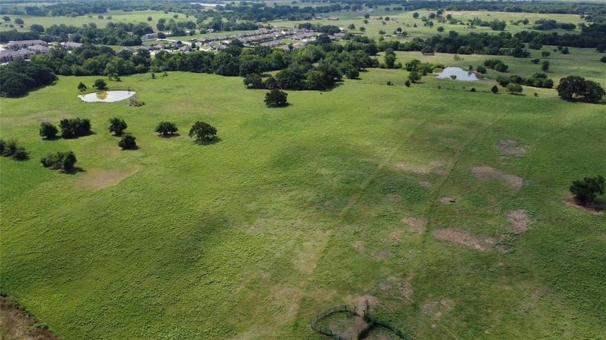 Expansive opportunities await this 45.402 acre tract offering great possibilities, located on the newly established Wildcat Way surrounded by growth and development. Close proximity to Interstate 30, high traffic volume, nestled between two apartment complexes and a housing development. Two ponds, Ag exempt with cattle grazing and barbed wire permitter fencing. Buyer or Buyer's agent to verify all information, confirm intended or future use and restrictions with the City of Sulphur Springs.