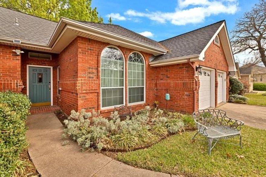 Well maintained Euless home in the Grapevine Colleyville ISD!!!  Hard surface flooring throughout this 3BR home with combination Living and Dining rooms, refreshed kitchen cabinetry designed with pullouts, kitchen island with access on both sides, kitchen and breakfast open to second living area making for a great entertaining area.  Primary suite has bay window sitting area and plenty of wall space for furniture. Outside is a trellised patio with ceiling fan making a great space to grill. Across the large grassy area is a workshop or storage building wired for electricity. The garage is oversized and has been wired with two 20 amp outlets. Low maintenance exterior with vinyl soffits and facia.