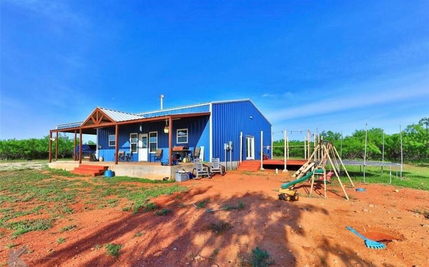 Experience quiet country living just minutes from Abilene, Dyess AFB, and the new AI Data Center. Built in 2021, this 1,600 sq. ft. metal-sided farmhouse sits on 38.43 acres of beautiful West Texas land—13 acres of cultivation and 25 acres of wooded pasture with a small tank. Inside, you’ll find 3 bedrooms, 2 bathrooms, and open, comfortable living spaces  for family or entertaining. Enjoy peaceful sunsets from the large front porch or host gatherings on the spacious side deck. A 4-vehicle carport provides plenty of covered parking. This property offers a blend of modern comfort and rustic charm—ready for anyone seeking space, freedom, and the quiet beauty of country life.