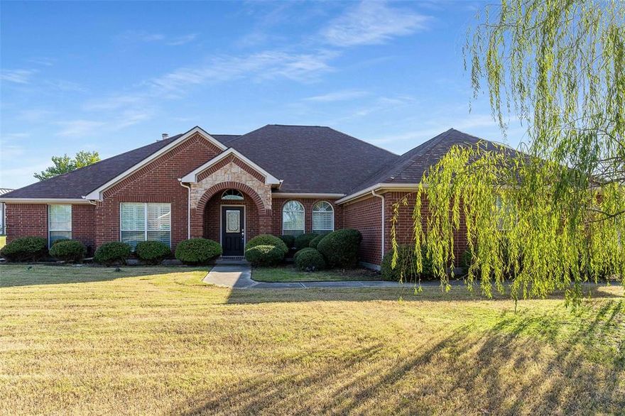 Nestled in the charming community of Wylie, Texas, this stunning single-story residence offers the perfect blend of modern convenience and timeless elegance. With four spacious bedrooms, two luxurious bathrooms, a split-bedroom layout, and expansive indoor and outdoor living spaces, this home is designed for comfort and entertaining. Expertly crafted with a brick and stone exterior, this beautiful property stands on an impressive 1.22-acre lot, ensuring both privacy and space for your lifestyle.

Step inside to discover a well-thought-out layout featuring two comfortable living areas and two dining spaces, allowing for versatile usage tailored to your needs. The heart of the home is the gourmet kitchen, complete with gleaming granite countertops and ample cabinetry, making meal preparation a delight. For those cozy evenings, gather around the inviting fireplace that adds warmth and ambiance to the main living space.

The primary bedroom offers a serene retreat with an adjoining en-suite bathroom, providing a private oasis of tranquility. Additional bedrooms are generously sized, ensuring comfort and relaxation for all.

Equipped with a spacious three-car garage, this home not only meets your everyday needs but also offers a unique storm shelter for added peace of mind. The expansive 24 x 50 workshop is a rare find, perfect for hobbyists or additional storage space.

Outside, the generously sized lot provides endless opportunities for outdoor activities and comes ready for you to create your ultimate outdoor oasis. Whether envisioning a garden, a play area, or simply enjoying the Texas sunsets, the possibilities are endless.

This exceptional property combines luxury with practicality, offering an unmatched lifestyle in one of Wylie's most desirable neighborhoods. Seize the opportunity to make this dream home your own. Experience the perfect balance of style, space, and convenience in this exceptional Wylie residence.