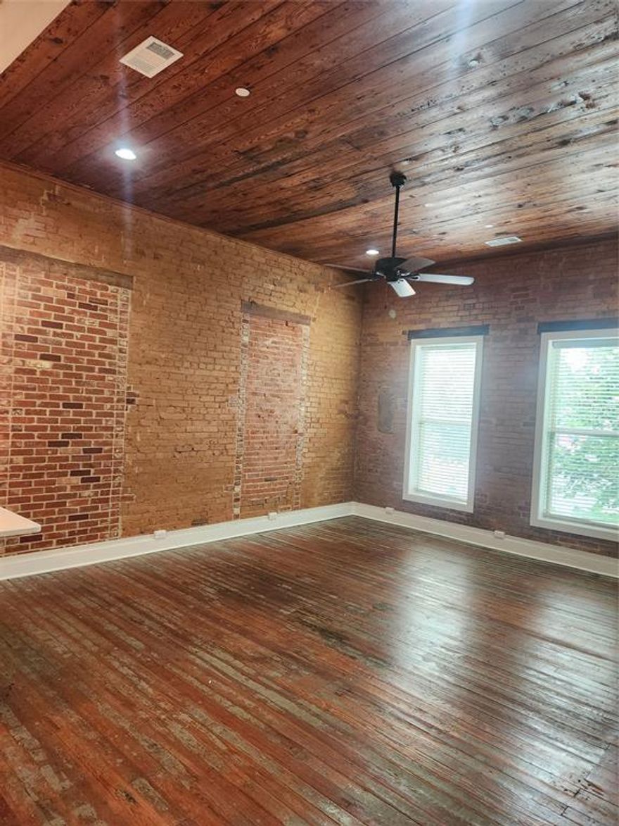 Welcome to this stunning loft apartment located in the heart of historic downtown Ennis, where modern living meets timeless charm. This unique space boasts a private entrance and features an open-concept design with high ceilings and exposed brick walls, offering a stylish yet inviting atmosphere. The spacious layout allows for flexible living arrangements, perfect for entertaining or relaxing. Enjoy the best of downtown living with everything at your doorstep, including the local ships, renowned restaurants, and Minnie McDowal Park. Just a short stroll away, you’ll find the local public theater, offering easy access to cultural experiences and entertainment. Whether you're enjoying the vibrant downtown scene or relaxing in your serene loft, this apartment provides the perfect blend of comfort, convenience, and character. Experience the essence of historic downtown Ennis in a space that truly feels like home.