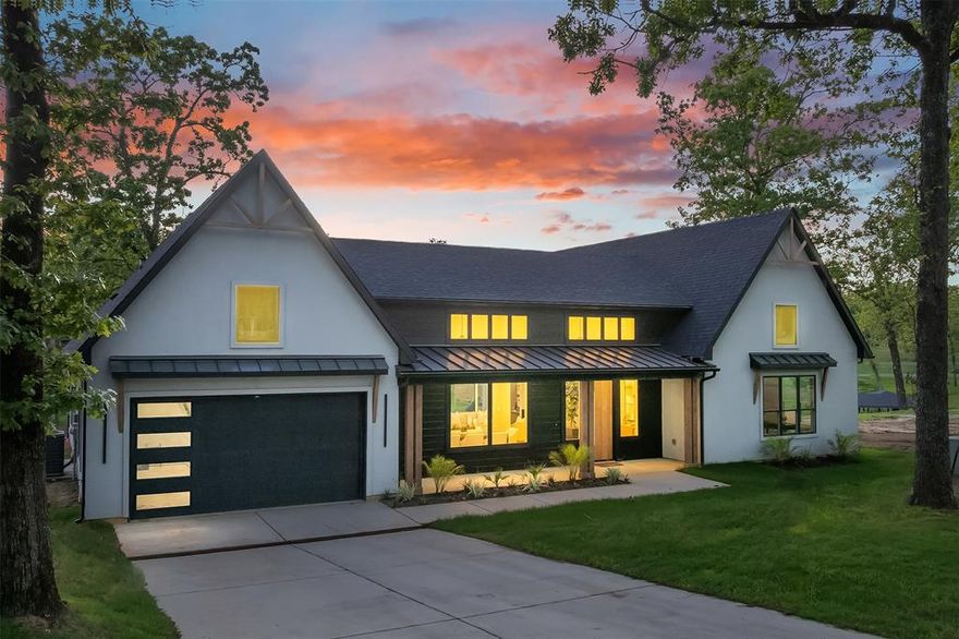 UP TO 3% IN SELLER CONCESSIONS WHEN USING OUR PREFERRED LENDER!  CAN SLEEP 8+. Located in the picturesque Red Bridge Cove at Pinnacle Golf Club. This stunning NEW CONSTRUCTION farmhouse, you’ll be welcomed by gorgeous white oak engineered floors and extraordinary chandeliers that hang from soaring ceilings, reaching up to 16 feet high in this open floor plan.

The kitchen is truly a chef’s dream, featuring a luxury appliances by Z-Line, a 9-foot island adorned with beautiful quartz countertops and walk-in pantry. The dining room showcases exquisite carpentry details inspired by the iconic keyhole pattern.

In the living room, an electric fireplace with customizable lighting options provides warmth and ambiance, set against a striking wall of floor-to-ceiling porcelain tile. The sliding doors effortlessly connect the indoor living space to the outdoor area, offering breathtaking water views.

The primary ensuite is exceptionally spacious, complete with a cozy sitting area and abundant windows that flood the room with natural light and stunning waterfront views. The primary bathroom features separate vanities, a floating tub, a separate shower, a private water closet, and a walk-in closet with built-in storage.

The FOURTH BEDROOM or BONUS ROOM (NO DEDICATED CLOSET, BUT WITH CONTRACT BUILDER WILL INSTALL) is filled with natural light and lake views.  This home, built by Coastal Plains Estates, exhibits exceptional attention to detail, including floor-to-ceiling tiles in all bathrooms. Both secondary bedrooms also enjoy fabulous water views. The ceilings throughout, except for the living, dining, and kitchen areas, are 11 feet high, and the interior doors are solid 8-foot doors. 

The outdoor experience is enhanced by a private patio featuring an outdoor kitchen with a sink, conveniently located off the interior kitchen with windows that open for easy pass-through.  Multiple seating areas, with steps leading down to your private covered boat dock.