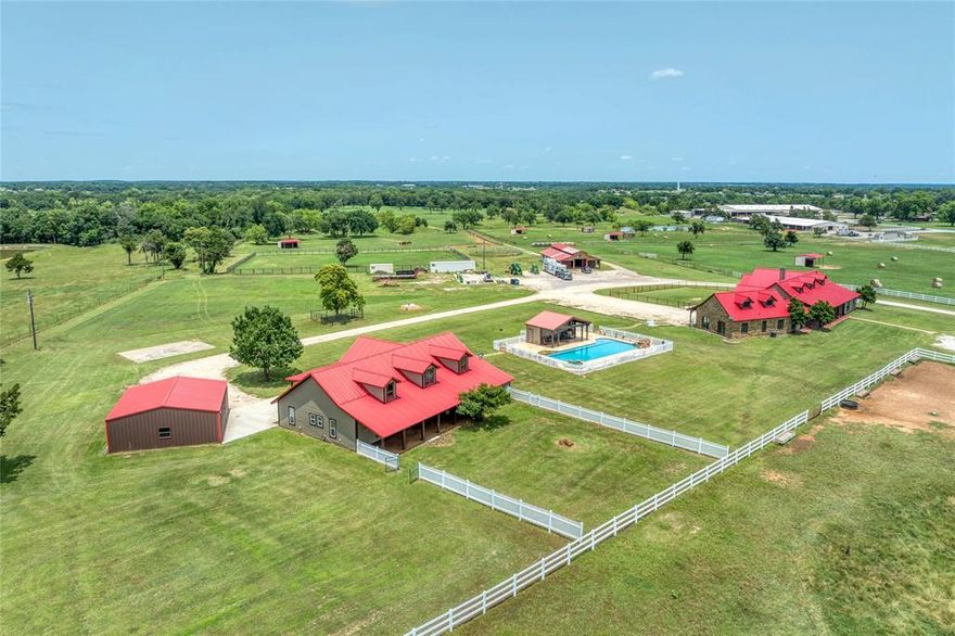 Presenting RT Arrow Ranch - Texas, a unique 63-acre property that features two custom ranch-style homes easily identified by their distinctive red roofs. The property boasts level to gently rolling sandy loam soil, predominantly covered with excellent coastal Bermuda grass. A wet-weather creek meanders through the lower pasture, accented by scattered oak trees. The homes are situated on a hill, providing lovely views of the surrounding terrain.***Main Home:** A custom 2-bedroom, 2.5-bathroom ranch-style home with an open concept design, covered porches, stone and wood siding, and a recognizable red metal roof. ***Guest Quarters:** A custom 603 sq ft apartment with an attached garage, connected to the main home. It features wood siding and a matching red metal roof. ***Cabana & Swimming Pool:** A poolside cabana with a half bath, a covered area for pool equipment and storage, wood siding with a red metal roof, and a fenced in-ground 5’ deep sport pool with a waterfall and hot tub. ***Foreman’s Home:*** A custom 3 bed + 2 bath open concept ranch-style home with a large flex room and loft, complete with porches, wood siding, and a red metal roof. ***Garage or Workshop:*** Features a concrete floor, metal siding, and a red metal roof. **Stall Barn:** A modular 6-stall barn equipped with a wash rack, bathroom, tack room, and a 12’ porch with a stone floor, stone columns, and a red metal roof. * **Pasture Shelters:** Six loafing sheds are located in the pastures. **Hay Shed:** Hay Shed located at north end of hay field.* **In-ground Storm Shelter.**  **Automatic Gate:** At the driveway entrance, leading to a gravel all-weather drive. ***Fencing:** The property is fenced and cross-fenced with pipe top rail fenced paddocks, white PVC fenced front pastures, and a combination of pipe and wire fencing around the hayfield. Water resources include:Two Way Water Special Utility District plus Two stock ponds. Electricity is provided by:Cooke County Electric Co-op
