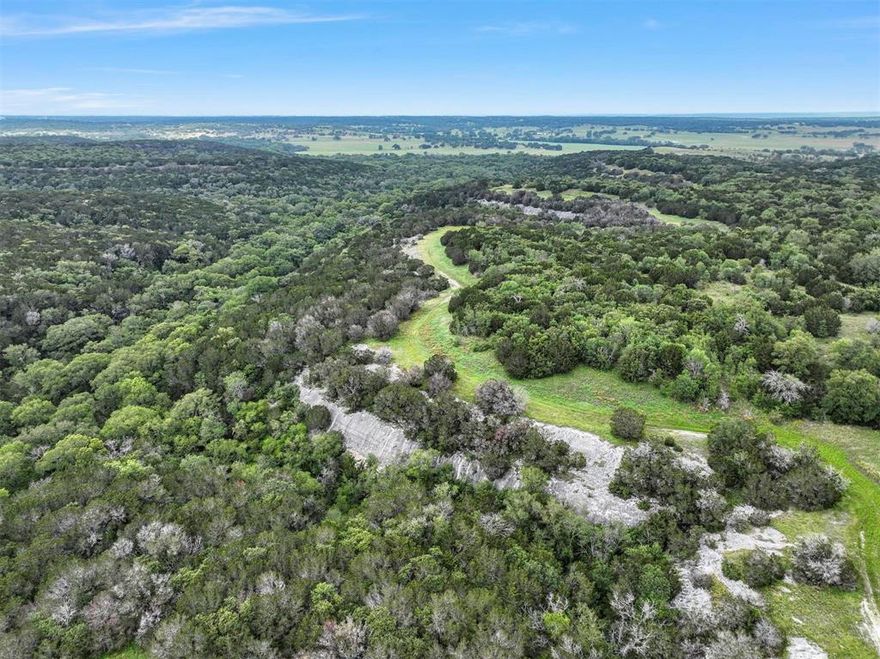 Majestic, pristine approximately 785-Acre Bosque County Ranch! Rolling hills, thick timber & winding creek - all just 1 hour from DFW and minutes to Lake Whitney. Stunning natural beauty abounds on this vast acreage. Currently being used as a cattle operation, this family-owned retreat could be used as a high-fence game ranch, horse operation, recreational ranch, hunting ranch or acreage development with more than 1.5 miles of road frontage. Rich in natural beauty with scattered hardwoods, sparkling, clear creek, rock outcroppings, mesas, and views as far as the eye can see. Abundant wildlife perfect for hunting wild turkey, white-tailed deer and hogs. This Texas paradise has been family-owned since 1961. Don't miss this rare opportunity to own a portion of the historic Circle 13 Ranch and to continue this Texas legacy steeped in rich history.
