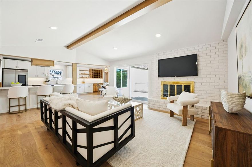 Stunning Full Custom Renovation with High-End Finishes
Experience refined living in this beautifully renovated home, where every detail has been thoughtfully curated. This full custom remodel features gorgeous white oak floors and matching custom millwork throughout, creating a cohesive and elegant aesthetic. The open-concept layout is enhanced by an abundance of natural light pouring through new oversized windows and doors.

The chef’s kitchen boasts all-new appliances, a gas range, built-in wine storage, and sleek custom cabinetry. The spacious primary suite includes an oversized walk-in shower, custom white oak vanity, and a generous walk-in closet. All bedrooms offer large closets, recessed lighting, and serene natural light.

Additional upgrades include new exterior siding, new insulation, a new water heater, and a charming river rock seating area—perfect for relaxing or entertaining. This is a rare opportunity to own a move-in-ready home with top-tier finishes and timeless design.