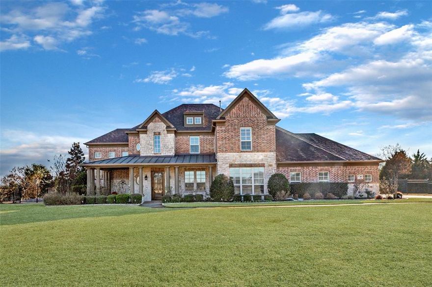 Completely renovated and meticulously maintained, this custom home overlooks the community lake and offers all of the features and updates you’ve been looking for! An extended covered porch welcomes you in, while refined, sophisticated finishes captivate inside, including hardwood floors, stone counters, vaulted ceilings, and modern designer lighting. The luxury kitchen anchors the home with top-tier appliances, built in refrigerator, Viking gas range, pot filler, an abundance of custom cabinetry, oversized island, and a striking stone accent wall. Living spaces flow effortlessly, including a sunroom framed by brick arches offering peaceful pond views, large Family Room with fireplace, well-placed Media Room with tiered seating for 6 and cinema-size screen, and a recently upgraded sub-level wine room with built-in cabinetry & wine refrigeration. Guests can enjoy a private suite on the main level, while a strategically placed study offers quiet solitude for working from home. Designed for unforgettable outdoor living, the heated resort-style infinity pool features a slide, waterfall & spa. Entertain with ease at the outdoor kitchen complete with pizza oven, fireplace, TV, gazebo, fire pit and extended patio for dining & games. Expansive grounds allow room for bocce ball & field sports while the upstairs turf-covered terrace offers a bird’s-eye view of the pool. From morning coffee to sunset cocktails, this setting invites memorable moments with friends & family. The Primary Suite is a true sanctuary, featuring a fireplace, sitting area, spa-like bath with soaking tub, oversized walk-in shower, and a generous closet complemented by a bonus room ideal for exercise or additional storage. Upstairs, accessible by dual staircases, you’ll find an abundance of bedrooms, all updated bathrooms, large Game Room and terrace access. You will appreciate Parker’s rural character & lower tax rates. This is not a house you simply tour — it’s a home you experience.