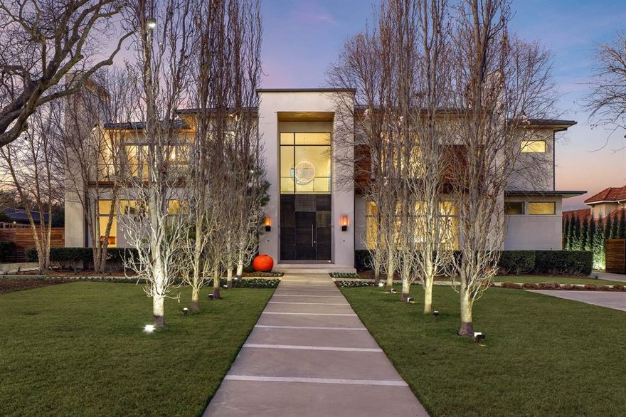 Extraordinary offering on nearly one acre nestled in a coveted Preston Hollow neighborhood, this custom 9,783 sqft estate blends timeless architecture w elevated everyday living. Designed for both grand-scale entertaining & intimate comfort, the home welcomes w a dramatic marble-clad foyer, soaring 12-ft ceilings & beautifully proportioned living spaces bathed in natural light. A statement fireplace anchors main gathering room, while walls of glass open to a heated & cooled outdoor loggia w remote screens- creating a seamless indoor-outdoor experience year-round. Formal dining room w gas FP provides an elegant backdrop for celebrations & everyday. At the heart of the home, the chef’s kitchen is impeccably appointed w Poggenpohl cabinetry, Sub-Zero, Miele & Gaggenau appliances, along w expansive center island & fully equipped butler’s pantry.  Primary suite is a true sanctuary, offering a private sitting area w FP, morning coffee bar & 2 secluded verandas overlooking the grounds. The spa-inspired bath features dual vanities, a soaking tub, an oversized dual-head shower & 2 generous custom walk-in closets. Upstairs, 4 additional ensuite bedrooms & a spacious game room provide comfort & flexibility for family & guests alike. Additional highlights include a secure safe room w exterior exit, wine room, formal study, exercise room, 2 laundry rooms & dedicated dog wash. Recent mechanical upgrades include 5 Trane furnaces replaced in 2026, ductwork replaced in 2026 & Leak Defense system—offering enhanced efficiency. Outdoors, the resort-style setting unfolds w a sparkling pool, striking linear fire feature & freshly striped pickleball-sport court, all framed by lush landscaping for privacy & beauty. A three-car climate-controlled garage w epoxy flooring loft, & whole-house water filtration system storage completes the home. Integrated smart home technology—including Control4, HEOS audio & remote window treatments—ensures modern luxury is always within reach.