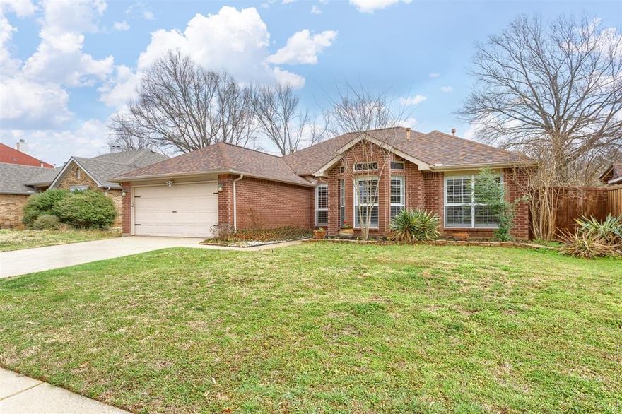 Beautifully updated and move-in ready, this unique-floorplan home offers standout style and comfort in the heart of Flower Mound for $500,000. Mature trees and plantation shutters create timeless curb appeal, while the interior features fresh paint, removed popcorn ceilings, and thoughtful upgrades throughout. The kitchen includes quartz countertops, a pantry, and a bright breakfast area that opens to a spacious family room with cathedral ceilings and an oversized fan. A bonus room showcases a floor-to-ceiling white-brick decorative fireplace with gas hookup and French doors leading to the large patio.  The primary suite features a tub, double vanity, seamless glass shower, and linen storage. Two front bedrooms and formal spaces offer flexibility. The fenced backyard is perfect for Texas evenings, with towering trees, a storage shed, and a gardener’s planter.
Additional highlights include an upgraded sprinkler system with wireless phone control, award-winning schools, walking distance to Marcus High School, and quick access to major freeways and DFW Airport.