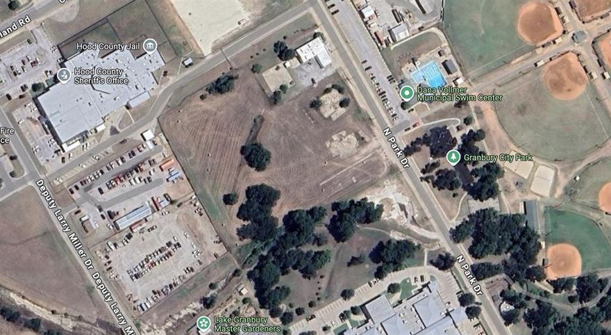 This prime 4.72-acre parcel offers exceptional development potential in a high traffic, unique location. Directly across from the city park and adjacent to the Granbury Justice Center, this property presents a wide array of possibilities. Whether you're envisioning law offices, multi-family residences, or even a pay-to-park lot for park visitors, the opportunities are endless. Take advantage of this unique opportunity and unlock its full potential..