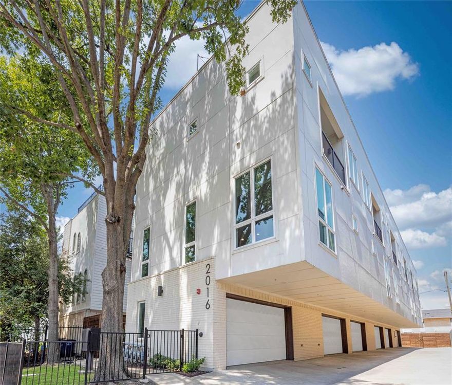 Modern finishes and design in this stunning end-unit condo, 2 bedrooms, 2.5 baths, and a 2-car garage in the highly sought-after Knox-Henderson area. Surrounded by some of the city’s hottest eateries, boutique shops, and vibrant nightlife, this walkable neighborhood offers the ultimate in urban living.
Spanning three stories, the open-concept floor plan is perfect for entertaining, with 11-foot ceilings, expansive windows that flood the space with natural light, and a Heat & Glo gas fireplace in the living area. The gourmet kitchen showcases quartz countertops, a glass subway tile backsplash in a striking hexagon pattern above the stove, a stainless steel farmhouse sink with pull-down sprayer, Whirlpool stainless steel appliances (dishwasher, gas stove, and built-in microwave), soft-close white cabinetry with nickel hardware, under-cabinet lighting, and stylish pendant lights.  Rich hardwood floors run throughout the main living areas, complemented by plush carpet in the bedrooms.
The white cabinetry continues into the primary and secondary bathrooms. The spa-like primary bath offers an enclosed glass shower with penny tile flooring and decorative lighting.  A private balcony from the primary bedroom. 
Unwind on your private rooftop terrace with breathtaking Dallas skyline views—ideal for gatherings.
Additional highlights include Nest thermostats, decorative ceiling fans on the second and third floors, and a laundry closet with built-in shelving. The garage is equipped with a Navien tankless water heater (temperature adjustable), LiftMaster garage door opener, five wall plugs, a large storage niche, and fire sprinklers on every floor—including the garage.
Enjoy the ease of HOA-covered utilities—water, sewer, and trash—along with quick access to Hwy 75 for a convenient commute within the city.