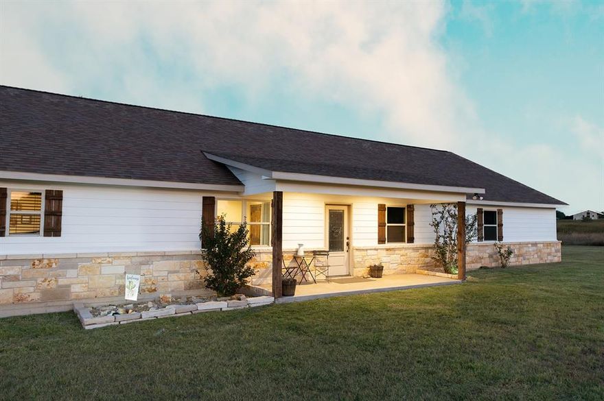 Located on a quiet private road within the gated community of Mercer’s Preserve south of Comanche Texas. This property combines comfort, function, and outdoor living. A circle drive leads to a two-car garage with an insulated workshop space and concrete ramp for mower or equipment storage. Above, an oversized attic with platform storage and folding ladder offers even more room.
Inside, the kitchen stands out with custom tall cabinets reaching the ceiling, adjustable shelves, granite countertops, and a built-in counter height desk. Wood floors flow through the kitchen, living, and high-traffic areas, with ceramic tile in bathrooms and carpet in bedrooms. The large living room features a vaulted ceiling soaring to 11 feet with wood accents. For entertainment, enjoy the media movie room with surround sound, oversized screen, and an overhead projector.
The primary suite offers two walk-in closets, a glass walk-in shower, and oversized jetted tub for relaxation. Each additional bedroom also features a walk-in closet, and the centrally located laundry adds convenience. Granite countertops are found in each bathroom, tying the finishes together.
Outdoor living is well planned with large covered patios facing east and west, raised garden beds with fencing, and a sprinkler system with six zones. The fenced 4–5 acre pasture includes a horse shelter, making this property ideal for those with animals.
Additional updates include fresh paint, a private well with water softener and filter, and a septic system with air pump, septic pump, and recently serviced and pumped
With its spacious layout, modern features, and acreage designed for both comfort and utility, this home is ready to enjoy—whether entertaining in the media room, working in the shop, or relaxing outdoors watching the beautiful Texas sunsets. Washer, dryer, and refrigerator are negotiable.
Call today for your private showing of this exceptional home.