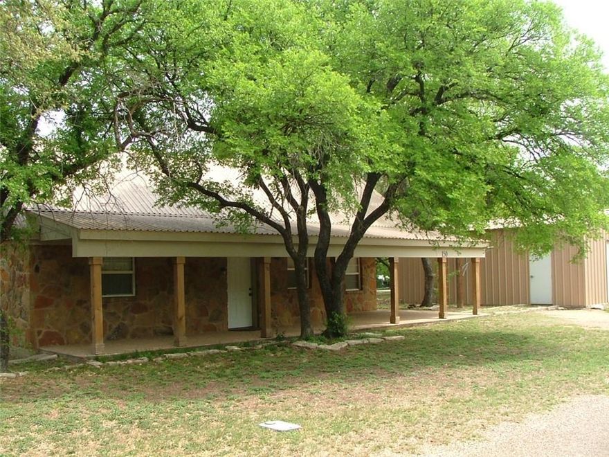 Hwy 22 to FM 3118 turn at CR 1700 (Whitney Ridge Resort sign) veer left on CR1700 turn left at CR 1722. 

Rustic rock home with custom cabinets, oak trim, 900 sq ft metal workshop/garage with 220 wiring. Large lot (over half acre) with numerous trees. Two blocks from the lake. Great escape from the city.