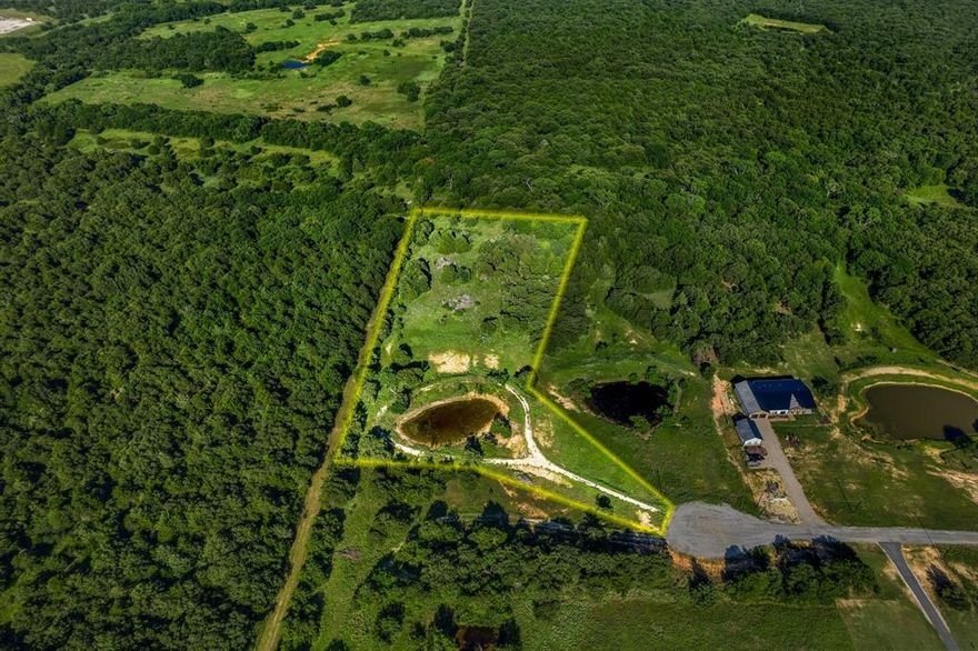 Come see one of the best developed lots located in The Ranches of Blackjack Meadow & enjoy endless views of cotton candy skies on over 5 acres. Located on a private cul-de-sac street & partially cleared with a drilled well, this lush setting is ready for development. Owner expanded existing pond for a larger water view.  Enter onto the rock driveway to find a rock pathway around the pond.  Build your own custom home including 1 large animal allowed per acre. Back of the property is separated with cattle fencing & natural dry creek bed on the eastern side.  Gorgeous trees & greenery set this spacious lot apart from others.  Quiet living with lower taxes & serene surroundings. $10,000 water well added in 2022.  Located just southeast of Nocona with easy access to HWY TX-59.