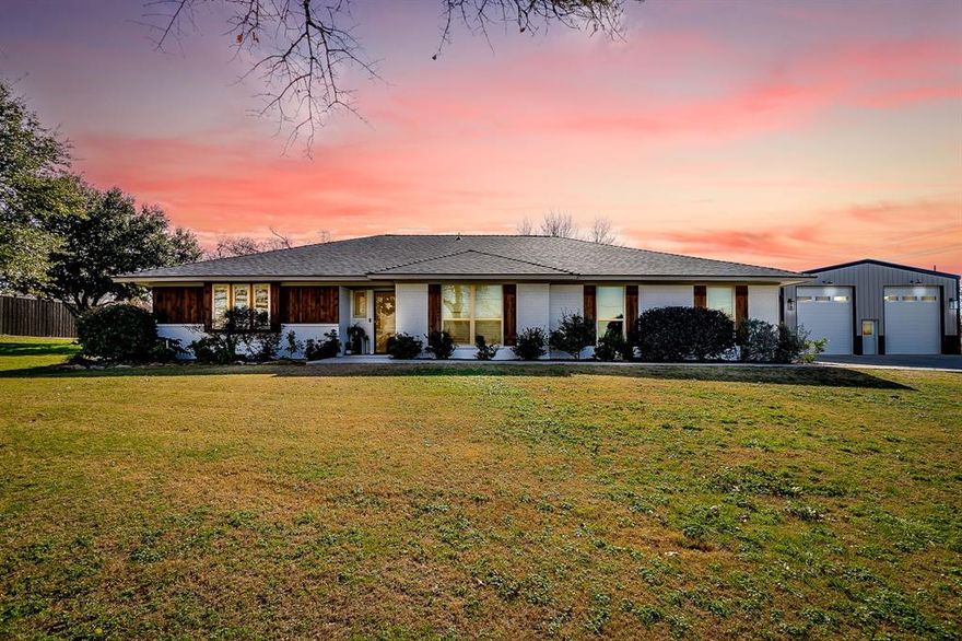 Welcome home to a rare blend of exceptional luxury, timeless character, and wide-open space. Set on a spacious lot with mature trees and an expansive front lawn, this beautifully updated single-story residence offers peaceful country vibes with everyday convenience. Inside, the home is filled with natural light and warm finishes, creating an inviting atmosphere from the moment you arrive. The backyard is an entertainer’s dream, featuring a beach-entry pool with waterfall feature, spa, expansive turf lawn with private putting green, and a covered outdoor kitchen—perfect for year-round enjoyment. A standout detached shop offers unmatched versatility with a second-story office and a dedicated golf simulator room, ideal for work and play. Thoughtfully designed with quality finishes throughout, this one-of-a-kind property delivers privacy, functionality, and upscale living at its finest. Updates include: engineered wood floors and tile, kitchen remodel(2021), primary bath remodel(2021),Plumbing updates and 2nd bath updated(2021), electric panel updated(2021), exterior renovation(2024), custom patio, 4ton heat pump AC system, windows replaced, attic insulation, class 4 hail impact roof (2025), replaced aerobic septic system(2024), new concrete driveway and walkway. Please see documents for shop details and all other upgrades to this property as the list is extensive. Golf simulator setup to convey with a full-price offer. Pre-approval required prior to showing
