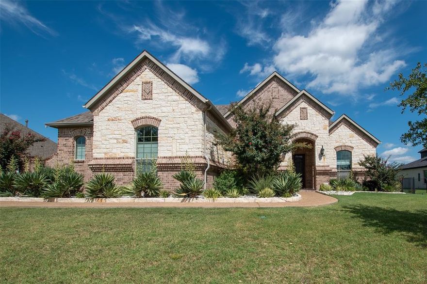 Semi-custom one story home quietly nestled in a small subdivision of Heath, TX, within walking distance to Lake Ray Hubbard. French country designed, with brick and stone exterior, with a fully landscaped half acre lot, along with an in ground Gunite pool and hot tub. professionally designed layout, this 4 bedroom, 3 bath home, has just under 3,000 sq. ft. of living space. as you enter the home, you are greeted with a beautiful cathedral like ceiling, with a private office on your right and an elegant dining area on your left. upon further entry, the gourmet kitchen: which features granite counter tops, breakfast bar, island, double ovens, 5-burner gas cooktop with a stylish vent-hood, and stainless-steel appliances, including the 
refrigerator. The family room is connected to the kitchen which contains a stone fireplace and inviting views of the back yard oasis. The primary suite, is a private retreat with bay windows, sitting area, and a spa like bath with a jetted tub, double vanities, walk in shower and a huge closet. all three other bedrooms are spacious and two have walk in closets. The backyard has a large, covered porch which looks out to the pool and nicely landscaped backyard. an oversized 3-car garage, which is attached to the home, has a side entrance feature. this one owner, professionally maintained home, must be seen in person to fully appreciate all that it has to offer. a separate attachment of upgrades and amenities is available.