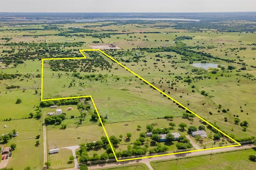 Experience the perfect blend of country living and modern comfort located on this stunning 34.7 acre farm and ranch property just a few miles from the Chisholm Trail Tollway and the new Amazon location in Cleburne,Tx. Whether you're a horse enthusiast or looking for development potential, this property offers endless opportunities. 
The updated 3 bedroom home features warm, inviting touches throughout, including bamboo flooring,a cozy fireplace, and two skylights that fill the space with natural light. The spacious kitchen is a standout with custom cabinetry, pull out faucets, double ovens, a prep sink, pantry, and lots of counter space. Spacious primary bedroom with walk in closets cedar lined, and a luxury bath with a soaking jetted tub, a shower with double spray heads, second bath in home is ready for your finishing touches, with most the bathroom fixtures already purchased. A large mudroom adds everyday convenience.
Recent upgrades include a 1 year old roof, and siding, giving peace of mind for years to come. The home is total electric and opens onto both a front and back deck perfect for enjoying the landscaped yard with fish pond. 
Outside the property is fully fenced and cross-fenced, with mature trees, and cleared land. Equestrian facilities are exceptional, featuring:
8 stall barn with electric
insulated wash bay
tack and hay rooms 
2 100 x 100 runs
pipe fencing
large open barn runway for vehicle access
additional features include:
conventional septic, 1 water meter with access to another , 4 water spigots for landscaping, 1 electric meter
Property is currently in the process of being replatted.
This property is ideal for horse lovers, ranching, or future development, offering privacy, functionality, and room to grow.