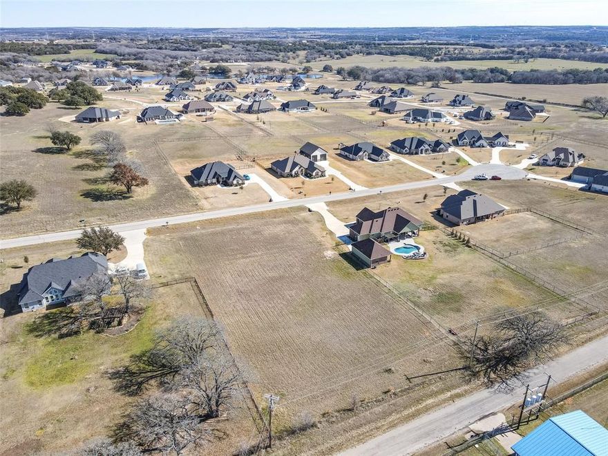 Come build your new custom home in the gated neighborhood of Rolling Creek Ranch, an easy 40 minute drive from downtown Fort Worth. The rolling hills, established oak trees and the stocked fishing tank are just a few of the reasons to come see is neighborhood in person. The property is located in Granbury, TX which is a three time winner of the America's Best Historic Small Town award and home to one of the best fishing and recreational lakes in the state. Come down and see why so many are deciding to call this community home.