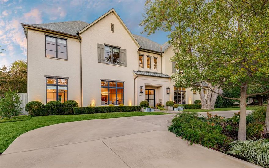 Transitional design, flexible living spaces and a seamless indoor-outdoor flow are the hallmark of smart, stylish living in Preston Hollow. This residence features a circular drive, mature trees, a cast stone entry  aluminum clad bronze windows and generator. Inside, soaring ceilings, hardwood floors and large windows create open, airy spaces. Main floor highlights include a formal dining room, two offices with custom built-ins, fully equipped wet bar with stunning glass enclosed chilled wine room and a chef-ready kitchen with top-of-the-line appliances. The spa-like primary suite is spacious and includes his and hers water closets and its own laundry room. A second en-suite bedroom completes the first level. Two sweeping staircases lead to the second floor with a must-see playroom, spacious media room with 120” TV, a wet bar, second laundry room plus 3 en-suite bedrooms. Outside is a turf yard, personal putting green, a covered patio-kitchen, resort-worthy pool and spa and driveway gate.