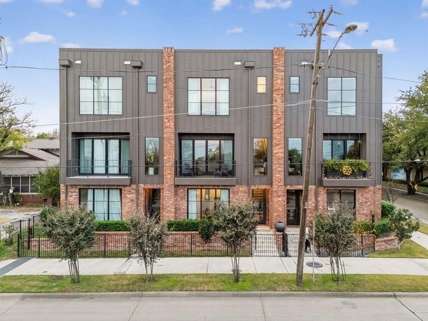 Stunning, fully turnkey 3-story modern townhome—just blocks from the vibrant Bishop Arts District! An open-concept layout connects the living, dining, and chef-inspired kitchen, highlighted by soaring ceilings and walls of picturesque windows that flood the home with natural light. The sleek kitchen features stainless steel appliances, quartz countertops, and an oversized island with exceptional storage. Enjoy fresh air and views from the spacious second-floor balcony, plus a private fenced front yard. Additional features include an attached 2-car rear-entry garage, fire-rated insulated party walls for enhanced privacy and peace of mind, water and landscaping included with the HOA dues. Enjoy unbeatable walkability. Hop across the street right onto the Dallas Street Car connecting you directly to Downtown, or enjoy a 10 minute walk to Lake Cliff Park, or head over to Bishop Arts District and enjoy all it has to offer, including highly acclaimed restaurants, coffee shops, boutiques and more! This is charming city living at its best—don’t miss it!