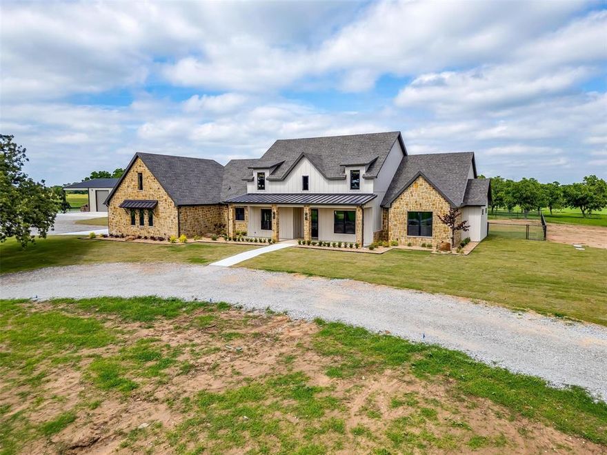 Beyond a stately,rock framed automatic gate,a tree-lined drive winds its way to a secluded and beautifully crafted estate.An extraordinary offering nestled on nearly 80 pristine acres,just beyond city limits.This exceptional property offers the rare combination of natural beauty and purposeful design, blending the charm of a working landscape with the refined comforts of a sophisticated home.The grounds include the original orchard,wooded areas,and a productive coastal pasture that recently yielded an impressive 269 rolls on the first cutting.Ideal for ag, livestock, or simple enjoyment of the land’s bounty.At the heart of the estate is a stunning 3,480sqft residence,where warm wood flooring, custom decorative lighting,and elegant ranch architecture create a rich and welcoming atmosphere.The open concept living area is designed to impress, featuring a dramatic retractable glass door that opens completely to an expansive 950sqft outdoor living space.This outdoor haven includes a fully equipped kitchen, fireplace, tv,and a newly landscaped, fully fenced backyard perfect for entertaining or quiet retreat.The interior offers four spacious bedrooms, with the flexibility to transform one into a refined study or library.A thoughtfully appointed chef’s kitchen is complemented by a butler’s pantry, wine rack, and built-in wine cooler, providing both beauty and convenience for daily living or elegant hosting.A short walk from the main residence, the oversized 50x100 workshop features three roll up doors and dedicated office space, ideal for equipment storage,creative projects, or running a business from home.The whole property generator ensures seamless comfort and reliability in any season,while the home’s central placement on the acreage offers both sweeping views and complete privacy.This is more than a home, it is a sanctuary,working estate, a legacy property.For those who seek luxury with purpose,and space to breathe, build, and grow, this extraordinary offering awaits.