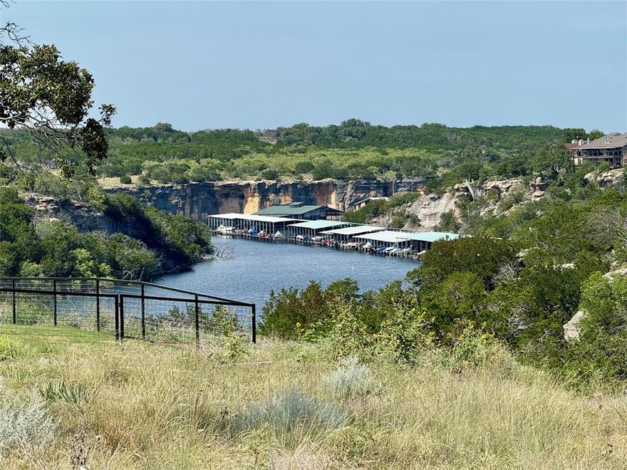Three side by side lots at Possum Kingdom Lake with water views are now available offering a rare opportunity for a builder investor or anyone wanting a little extra elbow room at the lake. Ideally these lots will be purchased together giving the buyer the ability to create a private retreat or a collection of homes that take full advantage of the lake lifestyle. Positioned close to the water and community amenities these lots provide flexibility to design around view corridors and outdoor living while still allowing privacy for each home.

The advantage of acquiring all three at once is simple peace of mind that your views and layouts will not be impacted by someone else’s construction. Whether you envision one estate style home with extra land a pair of homes for family and friends or three custom builds to market as lake getaways or short term rentals these lots are a blank canvas. The front lots enjoy closer proximity to the water while the back lot offers space for an additional home guest retreat or even room to expand outdoor amenities. Community Perks: Marina, outdoor live music venue, general store and grill, tennis courts, community pool, covered pavilion, and playground

Buy one or buy them all but the real value lies in keeping them together. This is an ideal setup for a builder who wants to showcase multiple designs or an investor who wants to control the look and feel of the buildout. Possum Kingdom Lake is known for its scenic beauty and active community and opportunities like this do not come around often.

These lots have water and sewage at the road.
