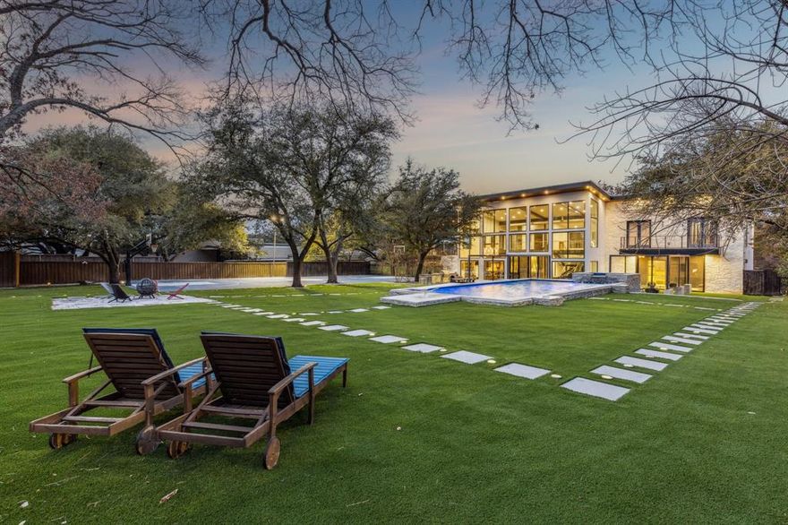 Set on nearly an acre in the coveted Hillcrest Estates, 6766 Northaven Road is a thoughtfully designed custom home completed in 2020, offering privacy, style, and exceptional indoor outdoor living. The 4,437 square foot open floor plan is highlighted by floor to ceiling windows that create a seamless connection to the expansive grounds. Featuring five bedrooms and five bathrooms, including a first floor primary suite, the home balances comfort with modern sophistication. Outdoor amenities elevate the lifestyle with approximately 1,000 square feet of porch space, a pool and spa, turfed backyard, putting green, tennis-sports court, and an outdoor kitchen perfect for entertaining or everyday enjoyment. A three car garage adds functionality, while the generous lot provides beautifully maintained front and backyards with potential for expanded living space. Ideally located near Dallas’ top shopping, dining, recreation, and the private school corridor, this property offers refined living in a premier location.