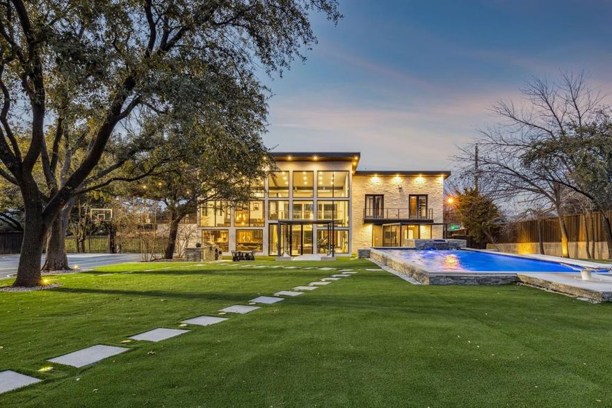 Set on nearly an acre in coveted Hillcrest Estates, 6766 Northaven Road is a thoughtfully designed custom home completed in 2020, offering privacy, style, and exceptional indoor-outdoor living. The 4,437-square-foot open floor plan is highlighted by floor-to-ceiling windows that create a seamless connection to the expansive grounds. Featuring five bedrooms and five bathrooms, including a first-floor primary suite, the home balances comfort with modern sophistication. Outdoor amenities elevate the lifestyle with approximately 1,000 square feet of porch space, a pool and spa, turfed backyard, putting green, tennis-sports court, and an outdoor kitchen—perfect for entertaining or everyday enjoyment. A three-car garage adds functionality, while the generous lot provides beautifully maintained front and backyards with potential for expanded living space. Ideally located near Dallas’ top shopping, dining, recreation, and the private school corridor, this property offers refined living in a premier location.