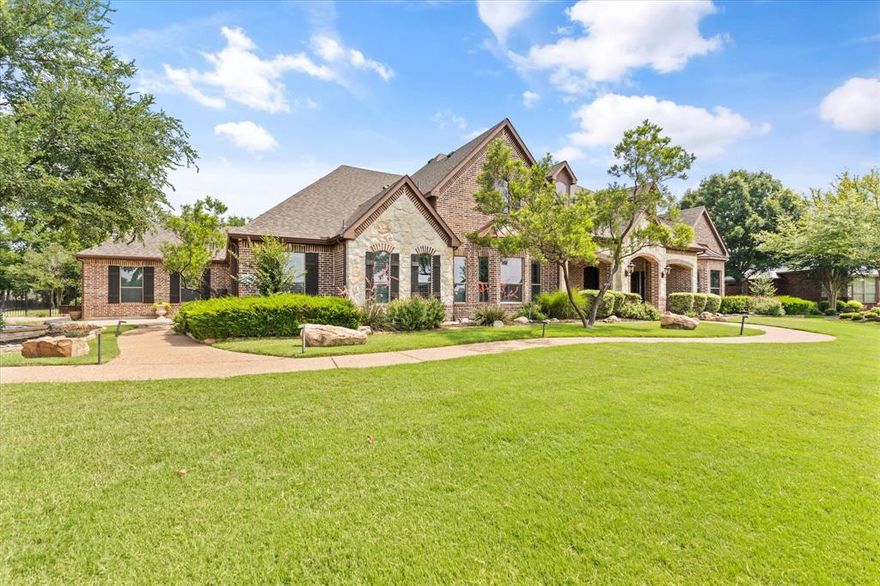 This one story Lovejoy ISD home has it all! Five bedrooms, four baths. Hand scraped hardwood floors throughout living areas and all five bedrooms. Stained concrete floor in game room. This home is perfect for entertaining and family life with bedrooms split three ways. Beautifully designed and landscaped private backyard with pool, spa, multiple covered patios, Sonos outdoor sound system and outdoor kitchen. Plus a separate yard with custom designed vegetable garden and integrated storage shed. FIVE car garage on one acre backing to a full tree line. Eight exterior hard-wired security cameras. Fire sprinkler system throughout. Central vacuum system. Sonos sound system in house and garage. New roof May 2023. Media room seating, projector, receiver and subwoofer will convey. 2 outdoor TVs will convey.