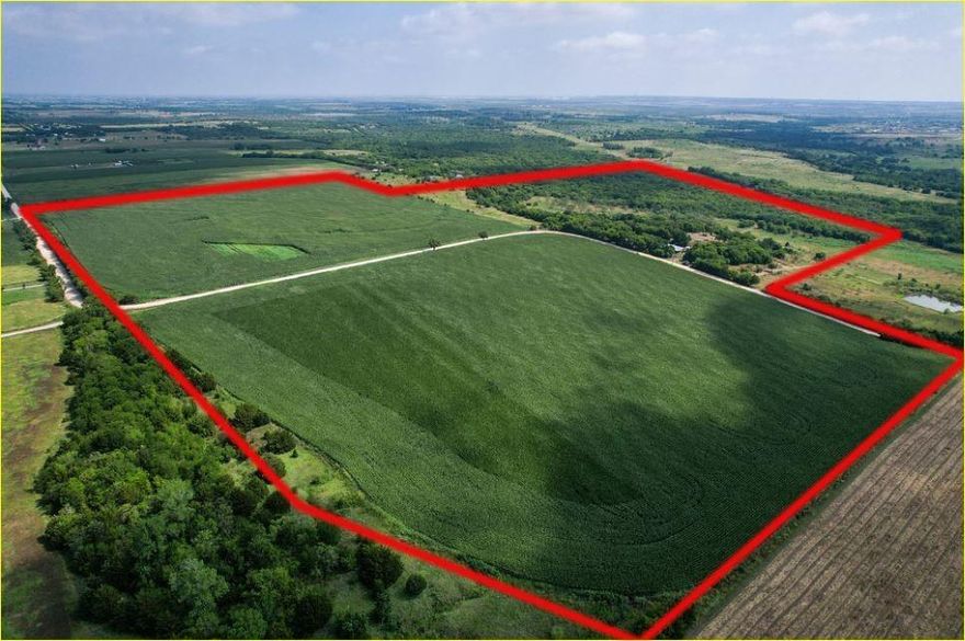 105.543 acres per survey with a combination of cropland and partially wooded pasture land. Great location in a  scenic rural area within easy distance of Ft. Worth, Dallas, Arlington, Mansfield areas. Wonderful building sites with views along a ridge overlooking the bottom land. Elevation changes of about 50 feet. With road frontage in excess of 3,000 ft. there are possibilities of subdividing. The property includes your own private well, equipment barn, various outbuildings, cattle working pens and an older home that would need a lot of work to be made habitable. Private wells and septic systems are needed in this area.
Buyers must individually verify all utilities, schools, and any regulations regarding building or subdividing. All mineral rights are excluded.